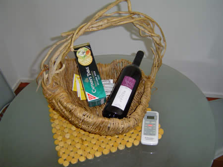 A basket with wine and biscuits