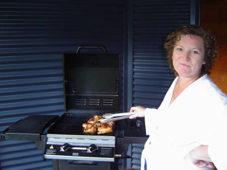 Maurren cooking chicken at the bbq.
