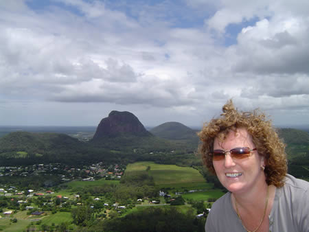Maureen at the top of Mt Ngungun with the scenerary to the south of the mountain.