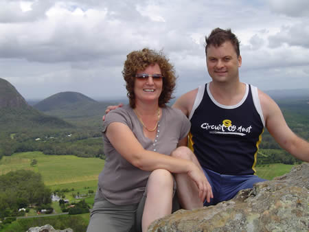 Maureen and I sitting on the cliffs edge at Mt Ngungun. It is a long way down.
