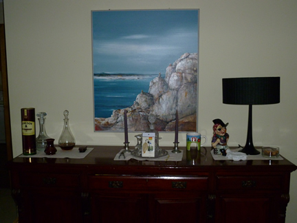This photo shows a painting and benchtop in Frank's lounge